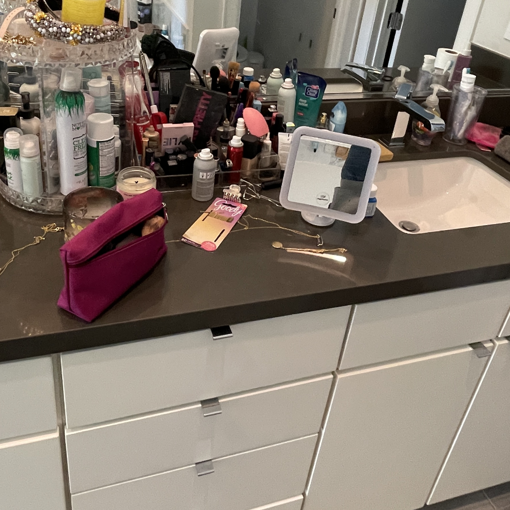 Messy Bathroom with Makeup All Over Counter in Montrose Neighborhood